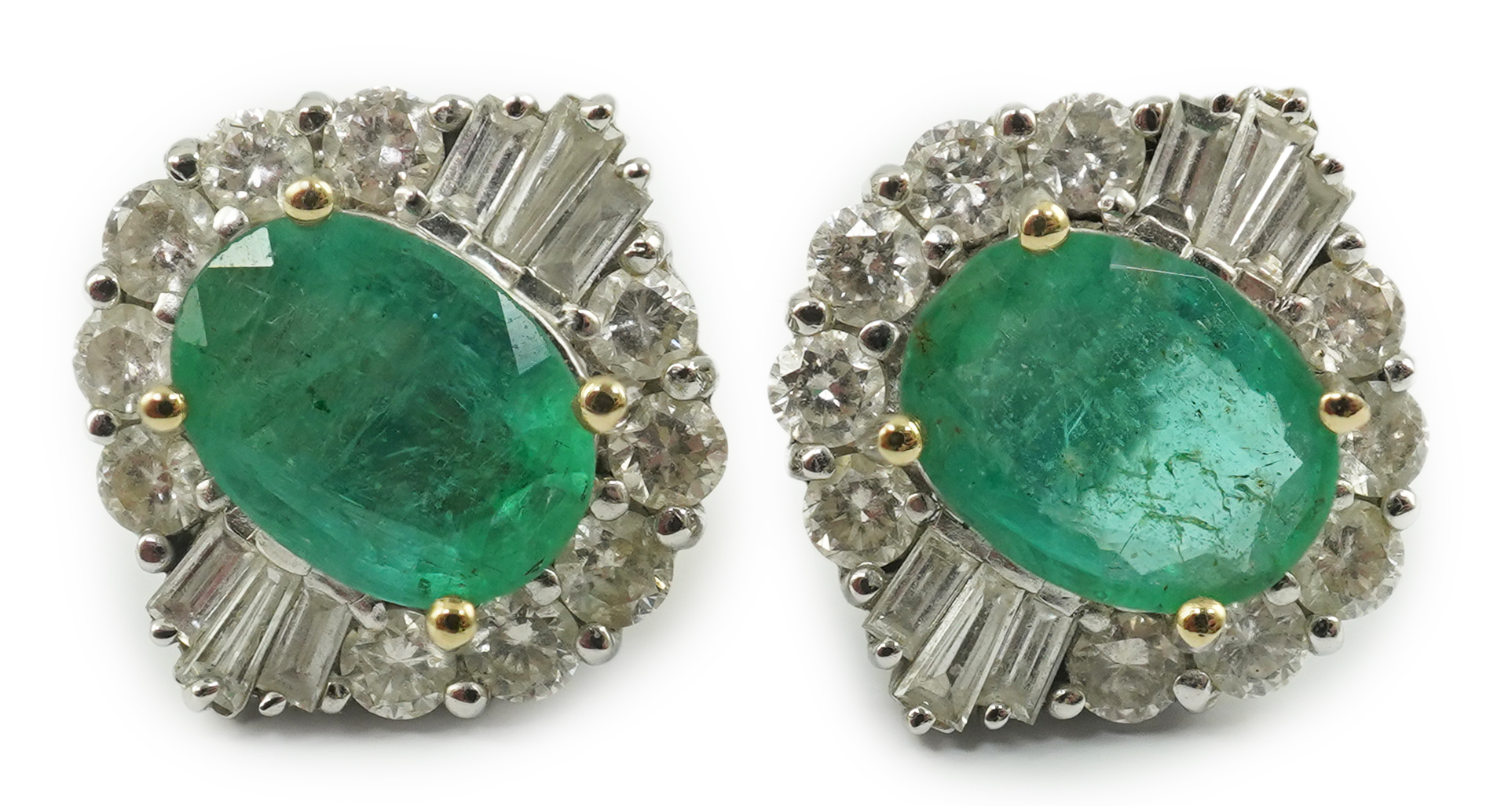 A pair of Art Deco style white gold, emerald and diamond cluster earrings